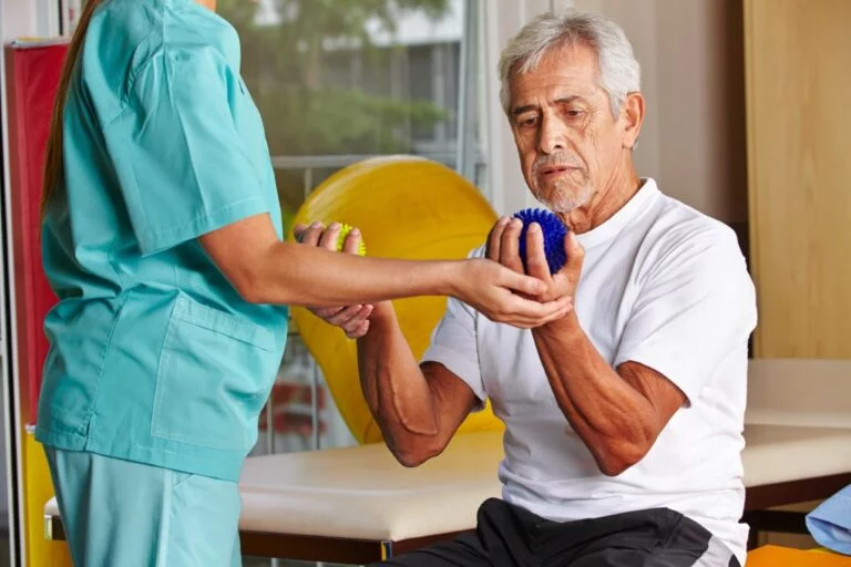 image of a man being treated by an occupational therapist