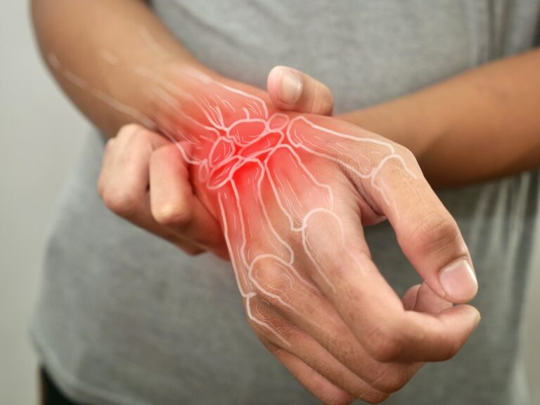 image of a patient suffering from pain in their wrist