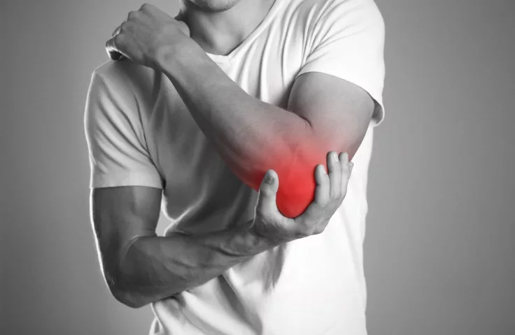 image of a man suffering from elbow pain